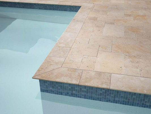 Ivory travertine bullnosed pool coping